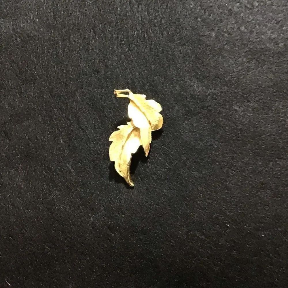 Brooch 2 golden leaves from estate sale Makers mark is DFA